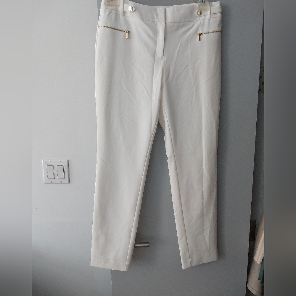 White pants with gold accents